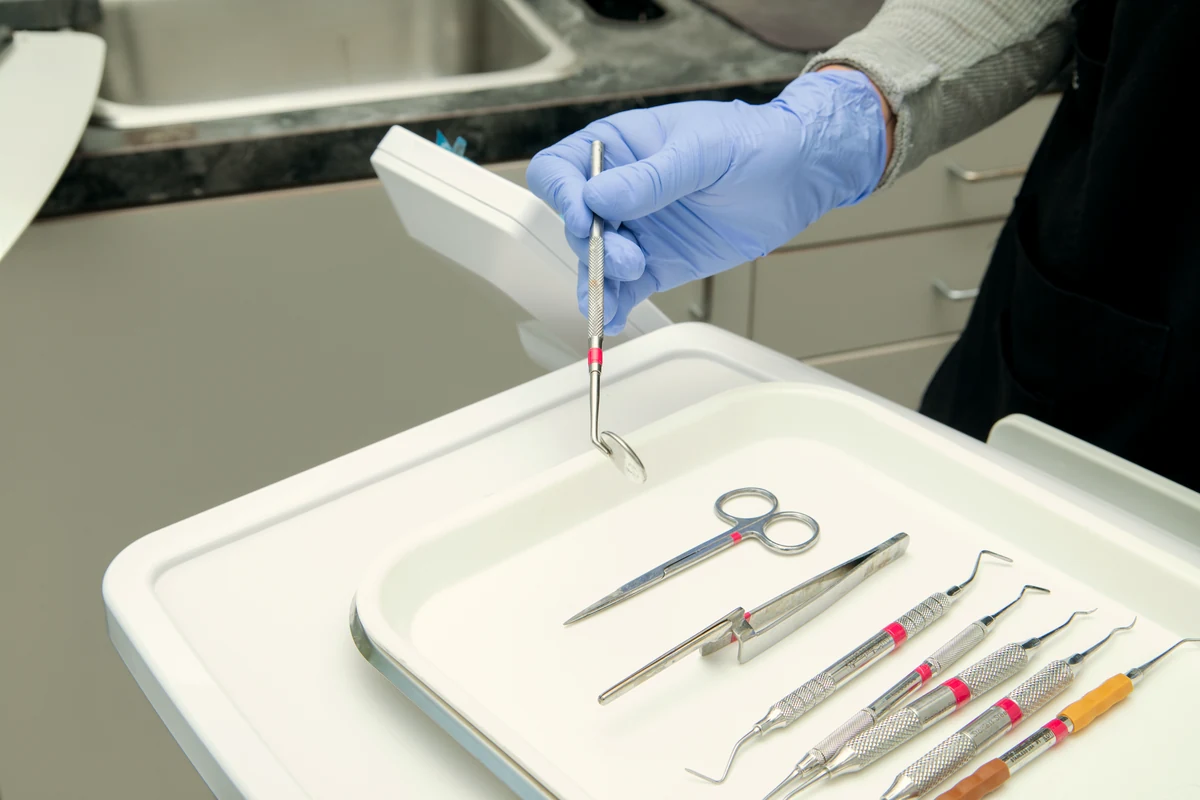 A sterile tray of dental instruments prepared for a biological dentistry visit