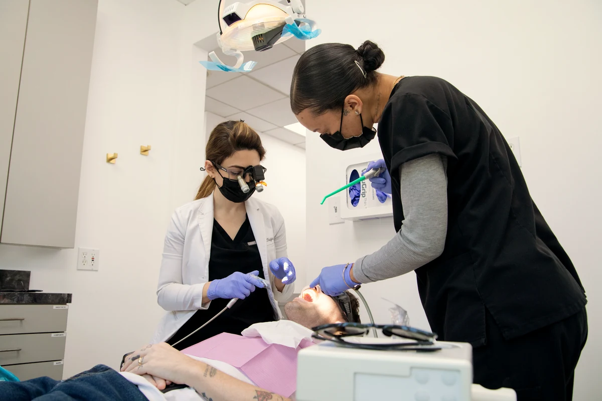 Dr. Mersedeh Rajinia performing a new patient exam