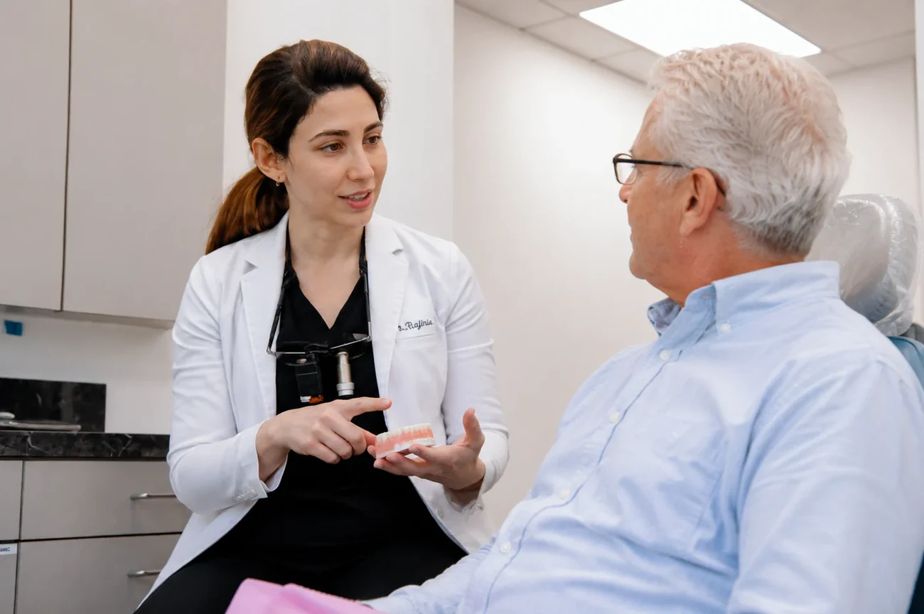 Dr. Mersedeh Rajinia discussing treatment options with a patient